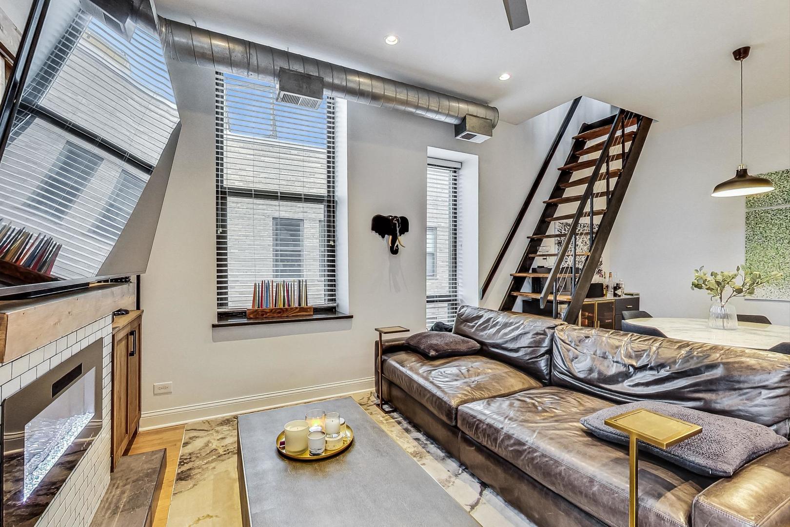 811 South Lytle Street, Unit 611 Chicago, IL 60607 - Photo 3 of 29 a view of a livingroom with furniture and a fireplace