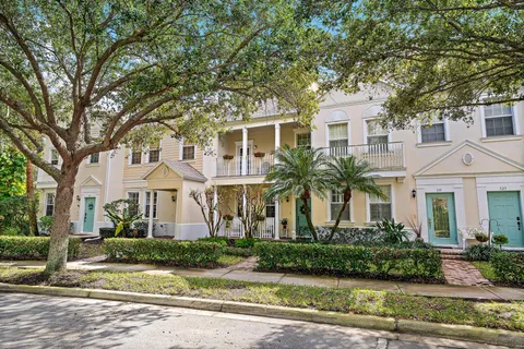 a sign that is sitting in front of flowers