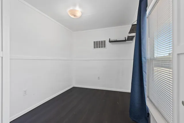 a view of hallway with wooden floor