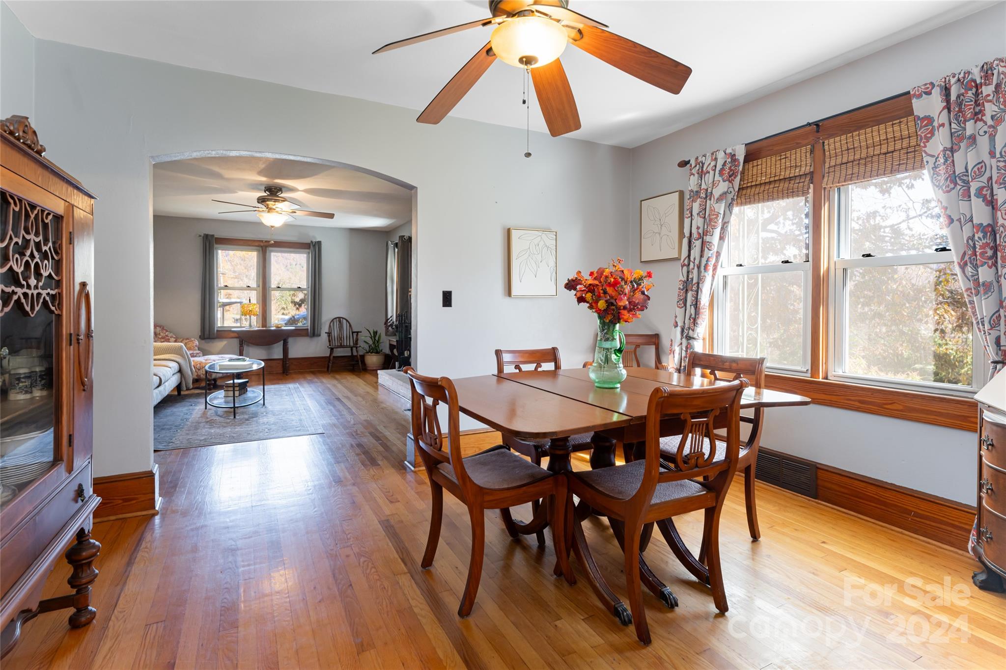 5074 Thickety Road Canton, NC 28716 - Photo 12 of 48 a view of a dining room with furniture window and wooden floor
