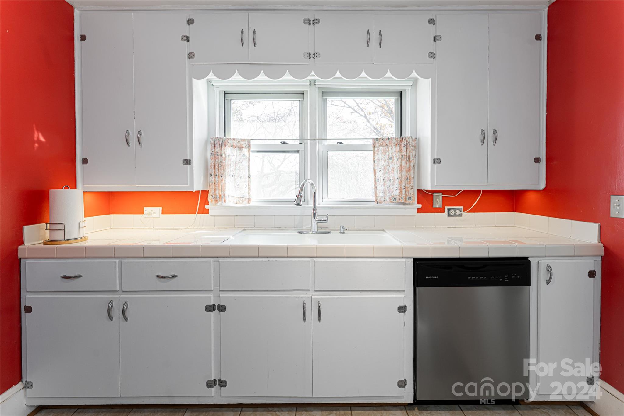 5074 Thickety Road Canton, NC 28716 - Photo 15 of 48 a kitchen with a sink cabinets and window