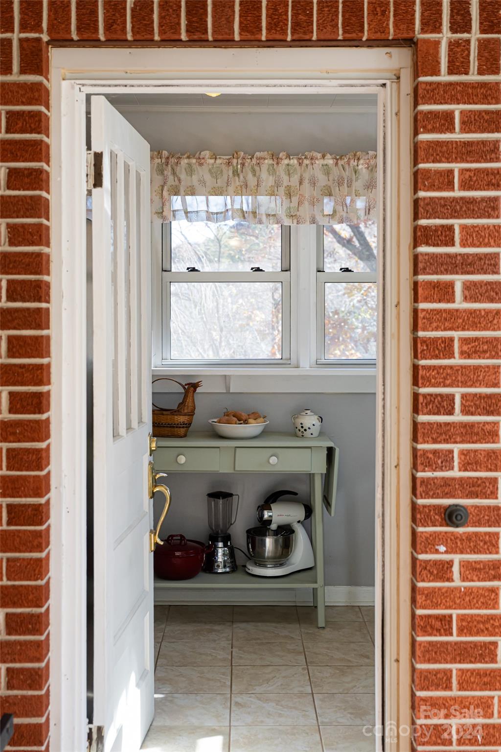 5074 Thickety Road Canton, NC 28716 - Photo 17 of 48 a bathroom with a sink and a window