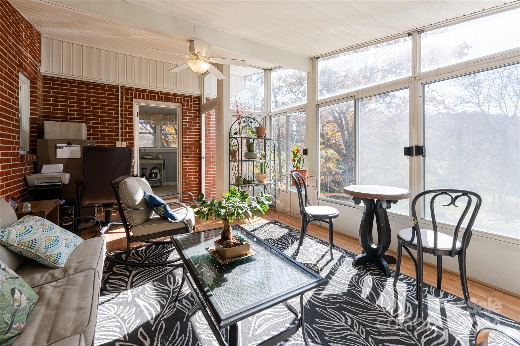 5074 Thickety Road Canton, NC 28716 - Photo 19 of 48 a living room with furniture and a floor to ceiling window