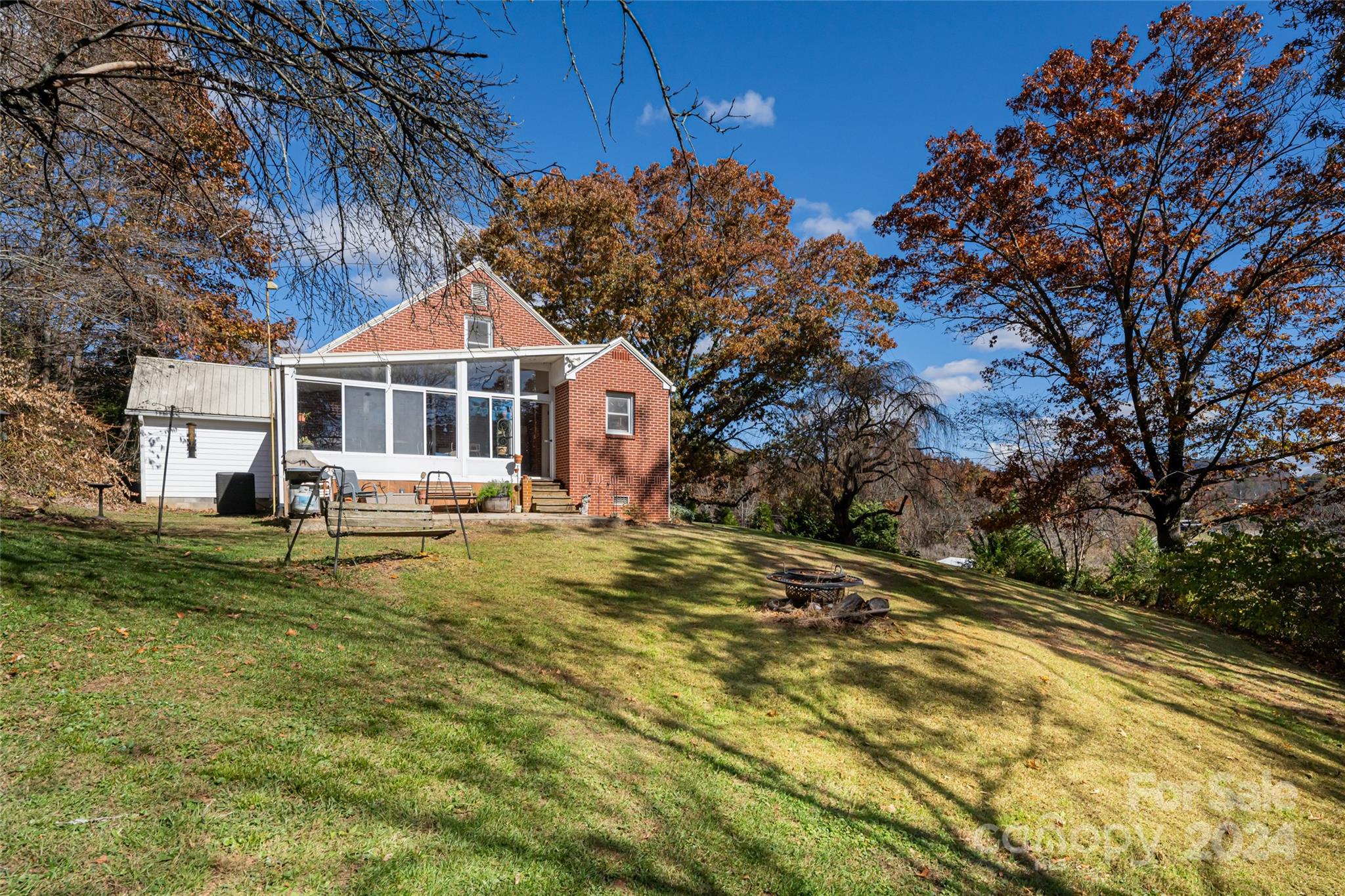 5074 Thickety Road Canton, NC 28716 - Photo 22 of 48 a view of a house with pool and sitting area