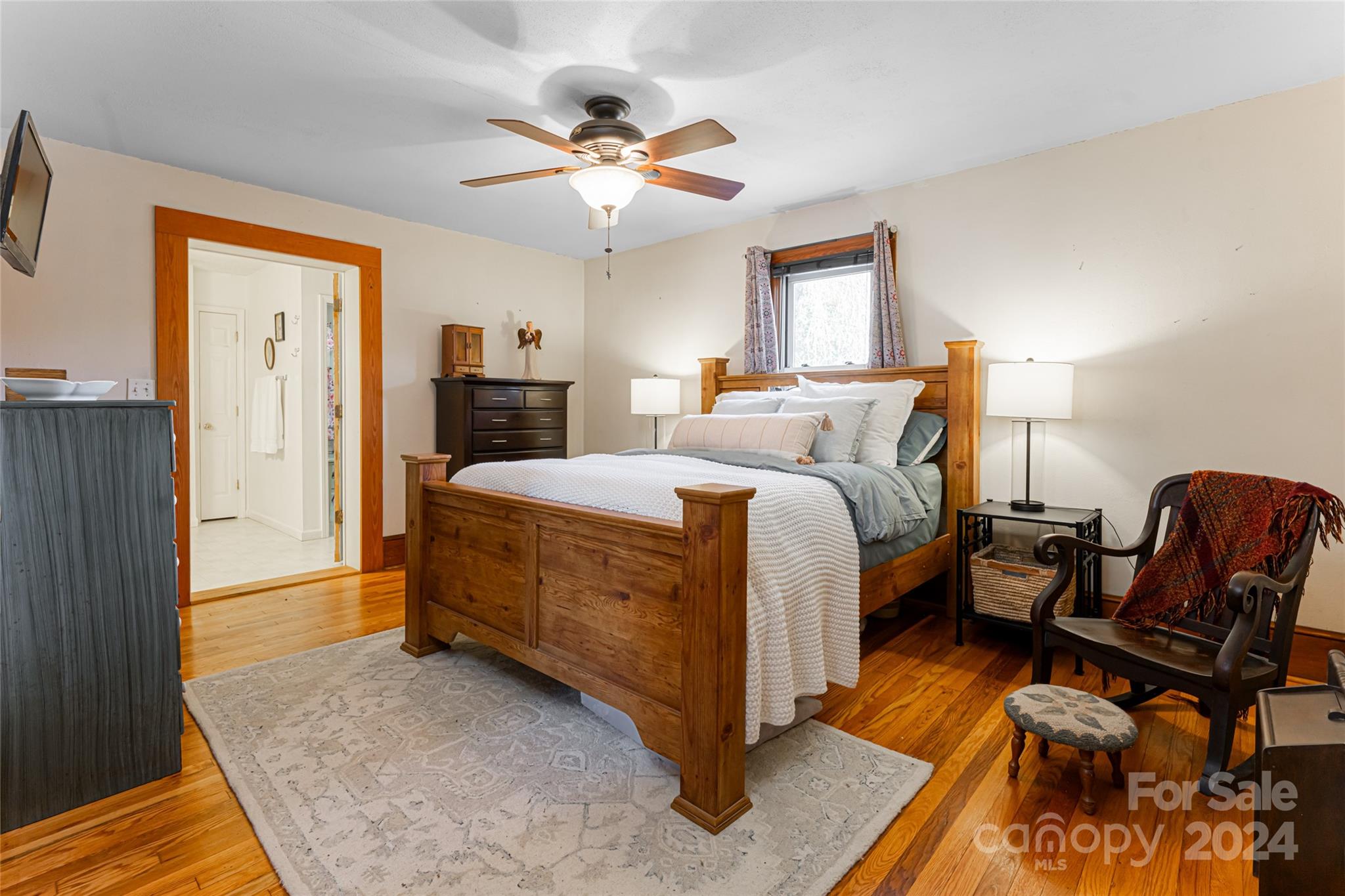 5074 Thickety Road Canton, NC 28716 - Photo 24 of 48 a bedroom with a bed and wooden floor