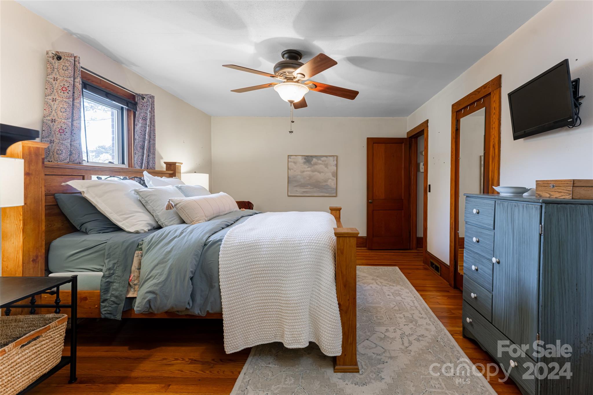 5074 Thickety Road Canton, NC 28716 - Photo 25 of 48 a living room with bed furniture and a flat screen tv