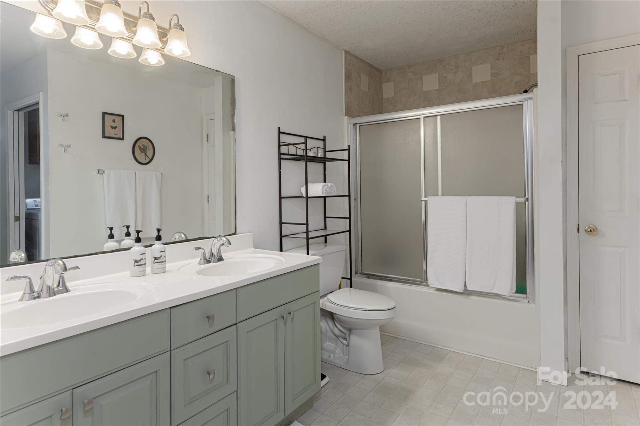 5074 Thickety Road Canton, NC 28716 - Photo 26 of 48 a bathroom with a sink toilet and shower