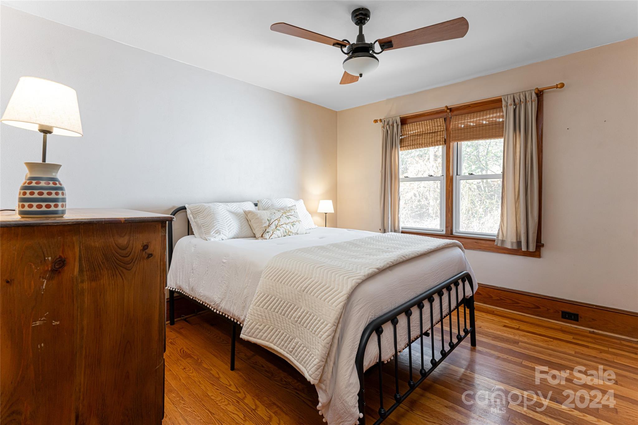 5074 Thickety Road Canton, NC 28716 - Photo 28 of 48 a bedroom with a bed and a chandelier