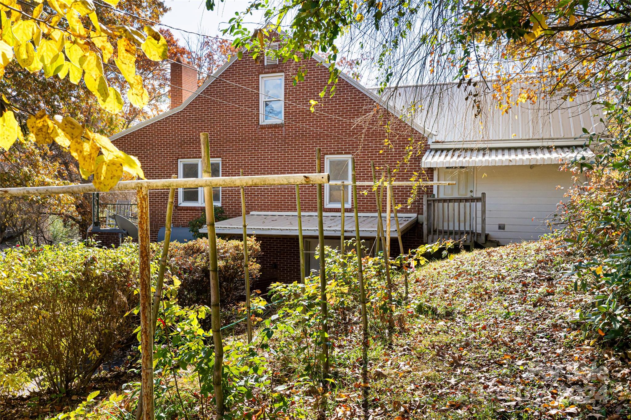 5074 Thickety Road Canton, NC 28716 - Photo 40 of 48 a brick building with a large tree