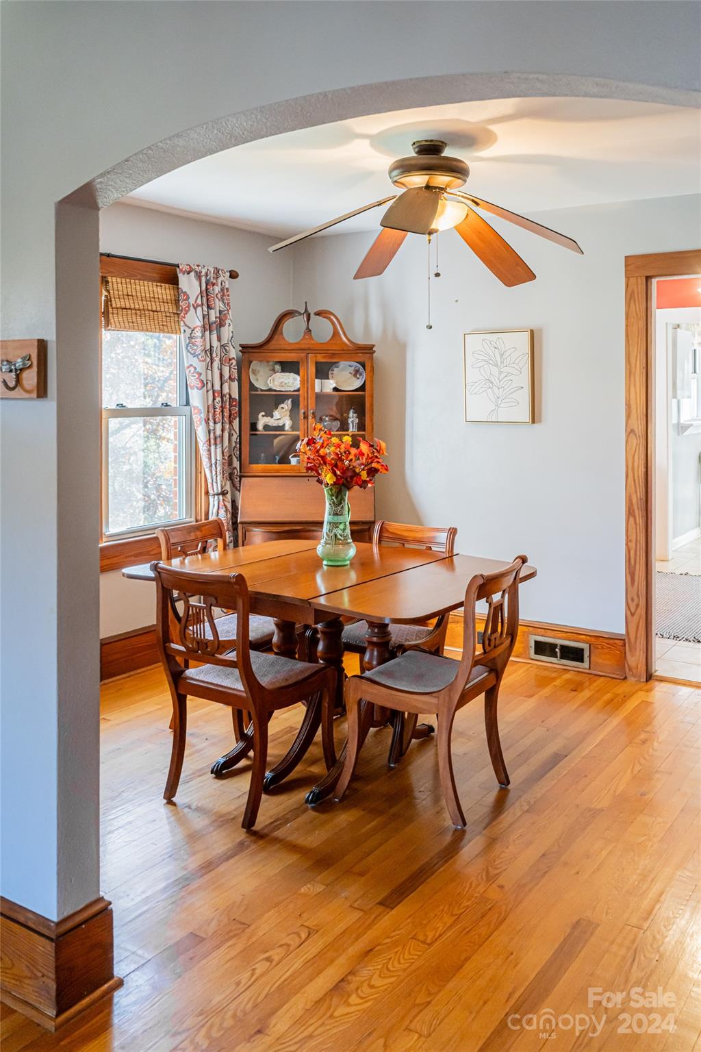 5074 Thickety Road Canton, NC 28716 - Photo 10 of 48 a view of a dining room with furniture and wooden floor