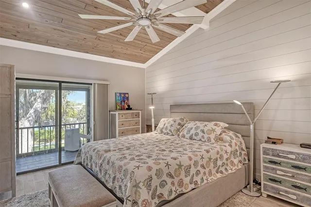 a bedroom with a large bed and a large window