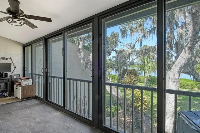 a view of a living room and balcony