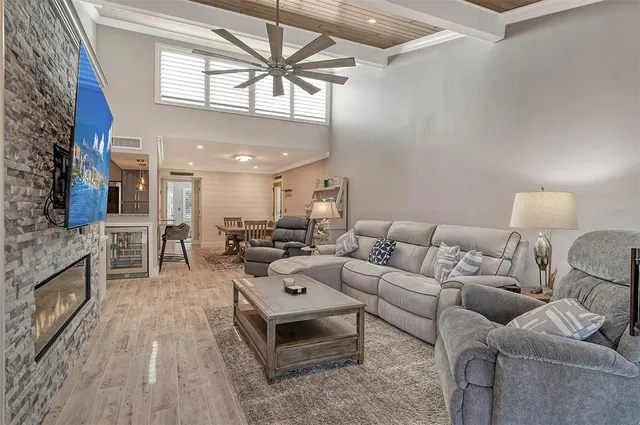 a living room with furniture wooden floor and a fireplace