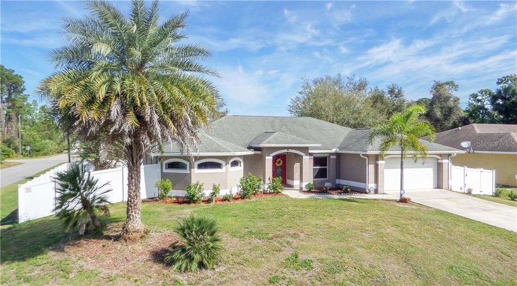 3622 Palestine Road North Port, FL 34288 - Photo 1 of 1 a front view of a house with garden