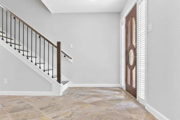 a view of an entryway with staircase