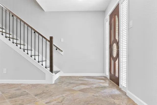 a view of an entryway with staircase