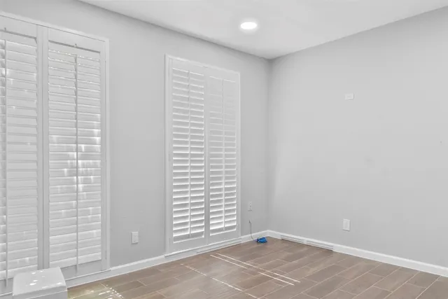 a view of an empty room with a window