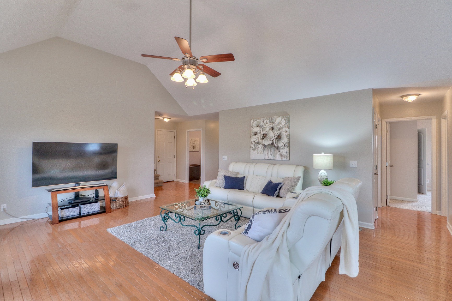 3580 Gnat Hill Road Manchester, TN 37355 - Photo 13 of 37 a living room with furniture a flat screen tv and a chandelier