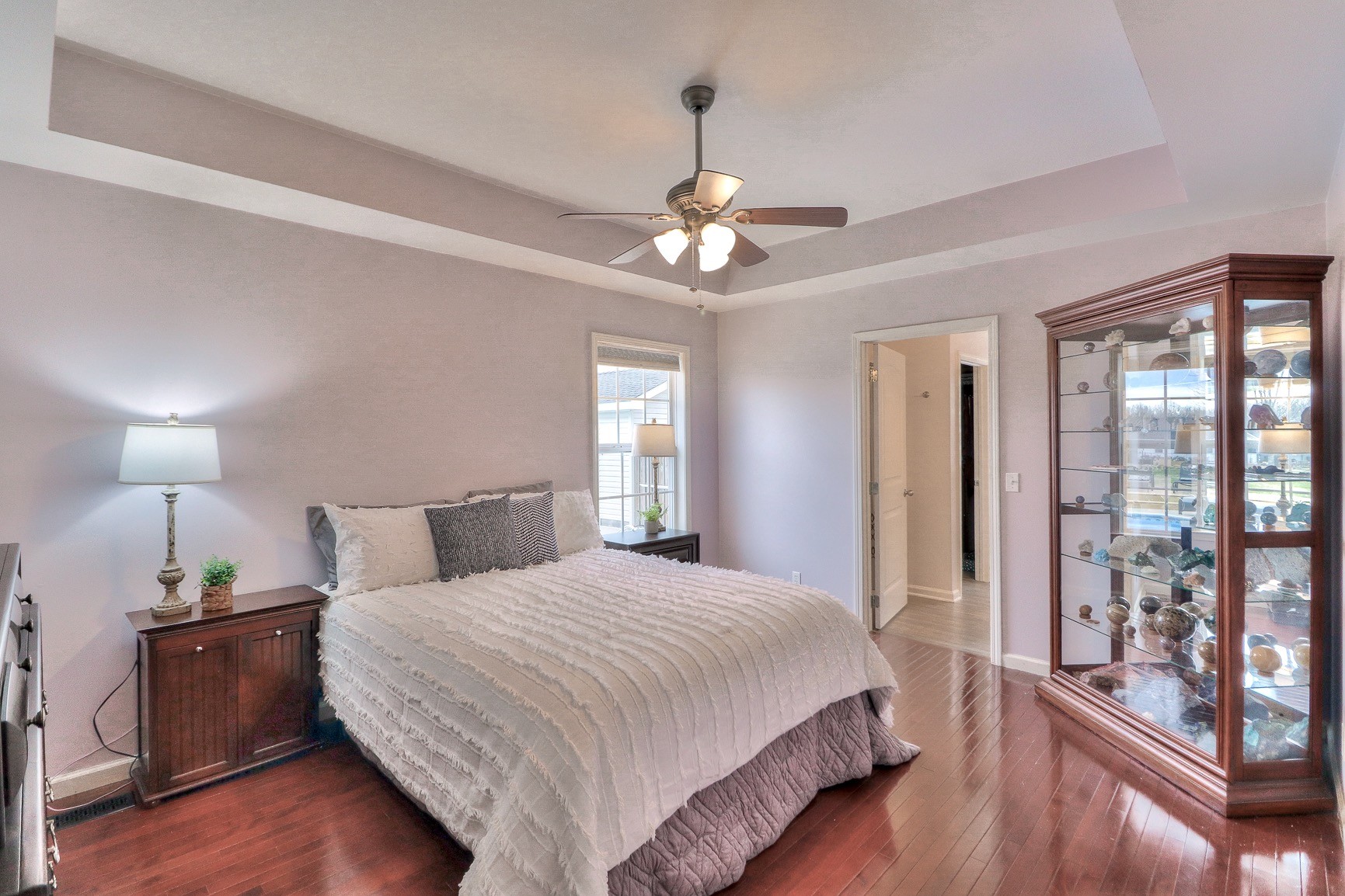 3580 Gnat Hill Road Manchester, TN 37355 - Photo 17 of 37 a bedroom with a large bed and a chandelier