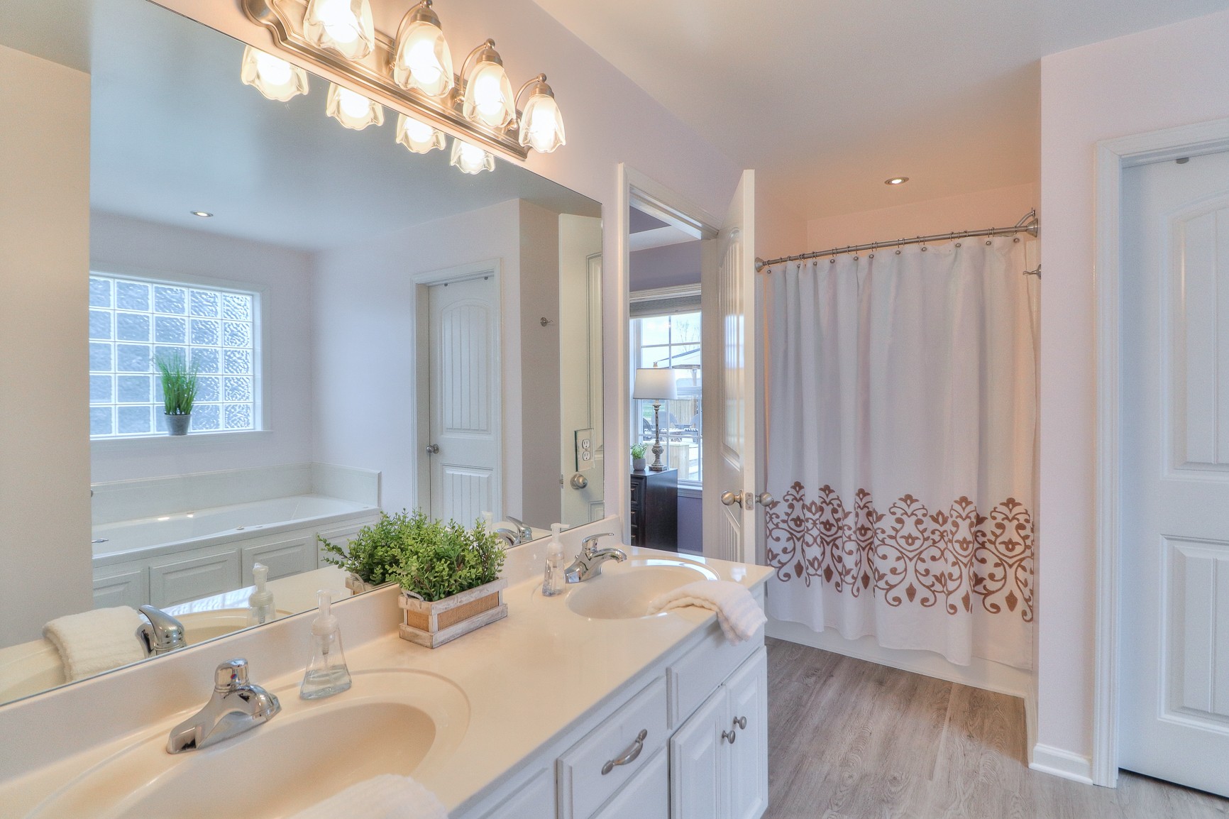 3580 Gnat Hill Road Manchester, TN 37355 - Photo 19 of 37 a bathroom with a granite countertop sink a mirror and a potted plant