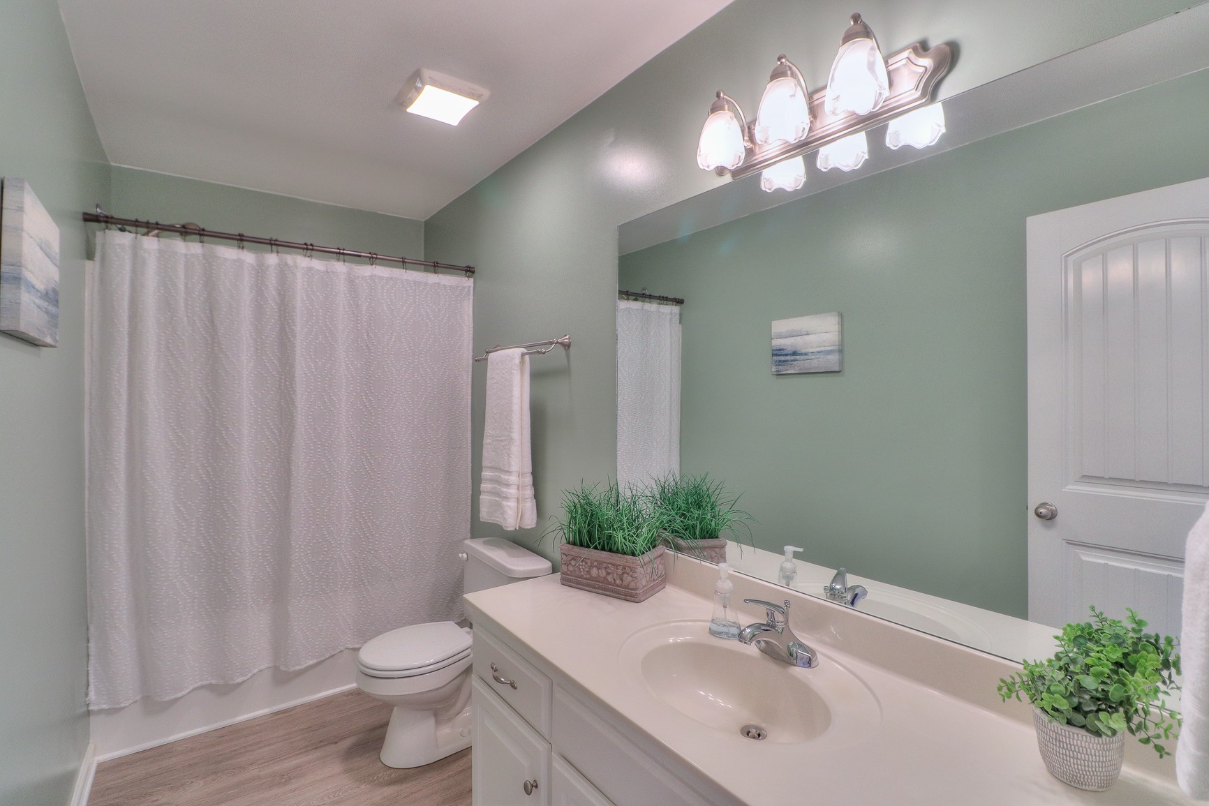 3580 Gnat Hill Road Manchester, TN 37355 - Photo 22 of 37 a bathroom with a sink vanity mirror and toilet