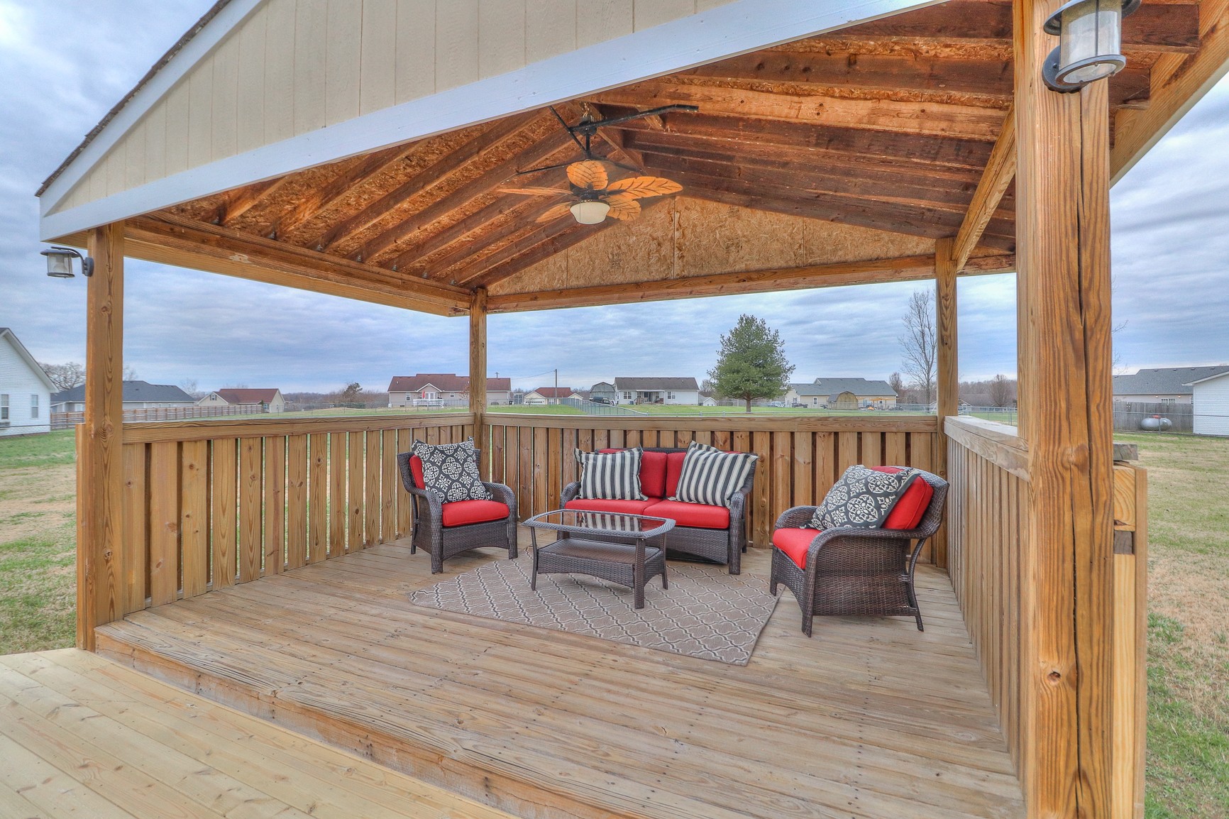 3580 Gnat Hill Road Manchester, TN 37355 - Photo 34 of 37 a balcony with wooden floor table and chairs