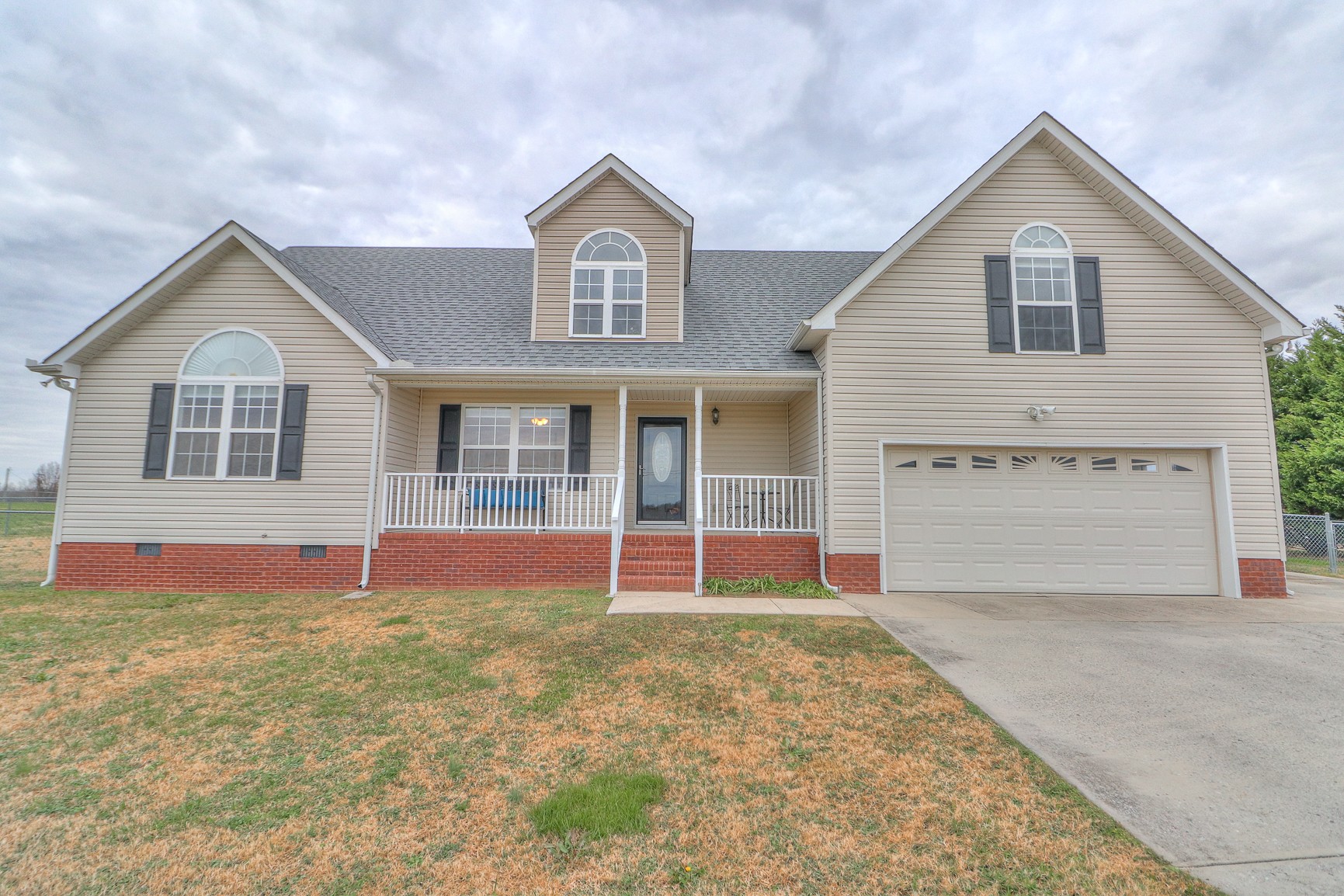 3580 Gnat Hill Road Manchester, TN 37355 - Photo 6 of 37 a front view of a house with a yard and garage