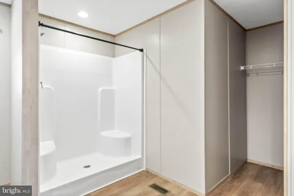 a bathroom with a glass shower door
