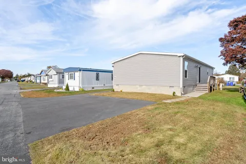 a view of swimming pool with a yard