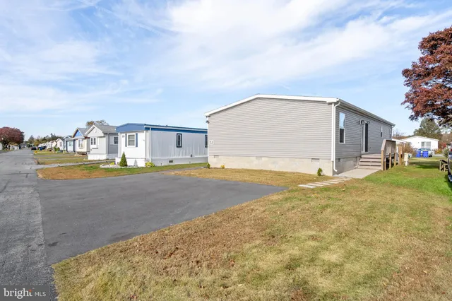 a view of swimming pool with a yard