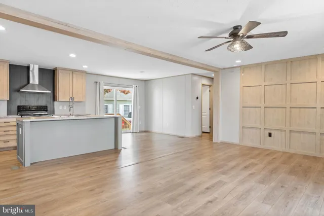a view of kitchen with cabinets appliances and a window