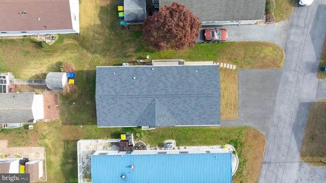 an aerial view of a house with a swimming pool