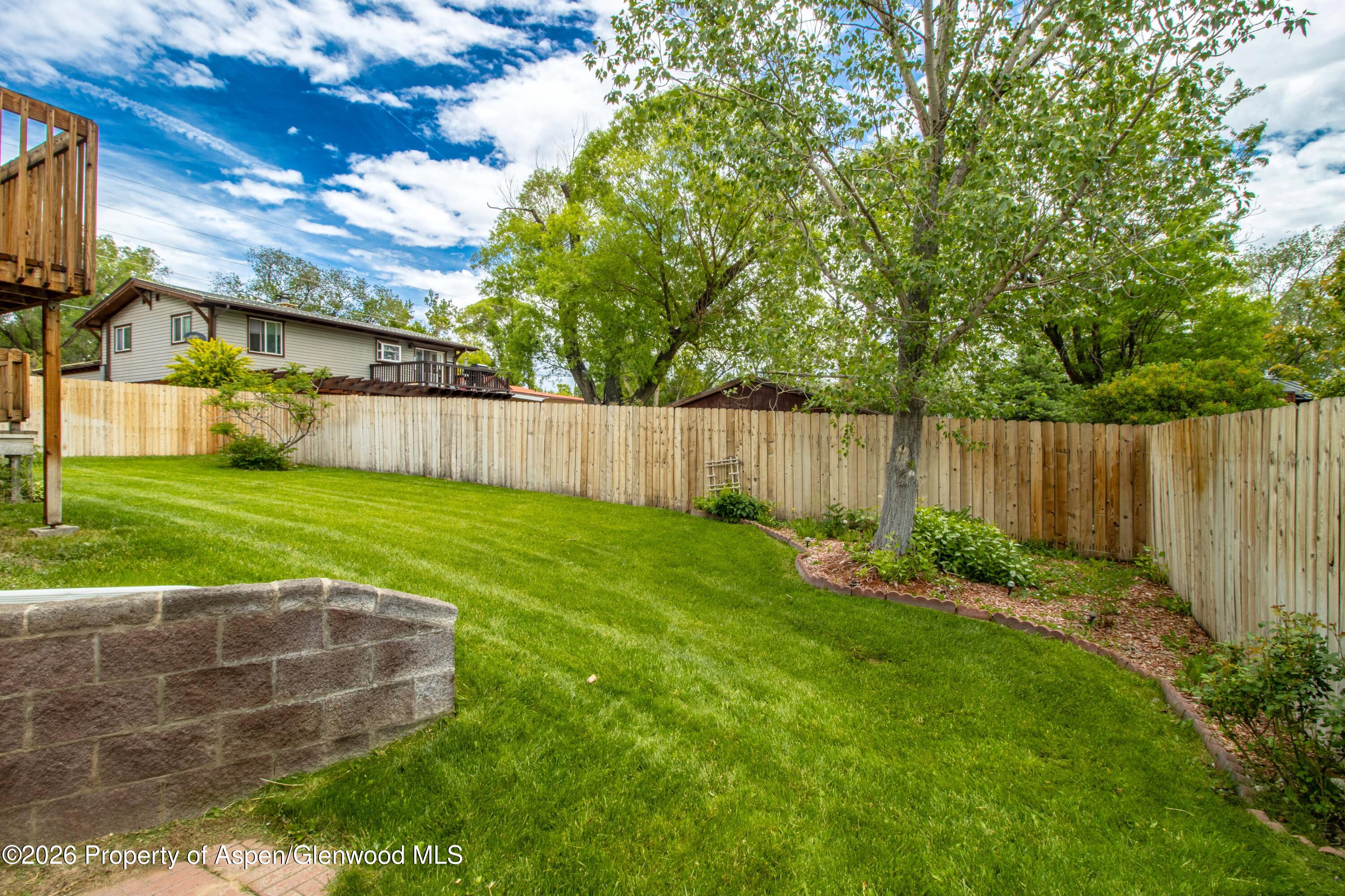 660 Aspen Avenue Rifle, CO 81650 - Photo 28 of 30 a view of a backyard with a garden