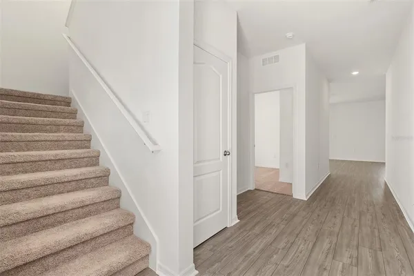 a view of entryway with wooden floor