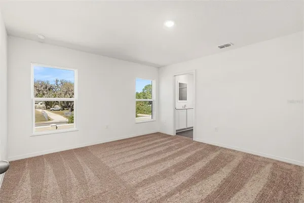 a view of empty room with windows