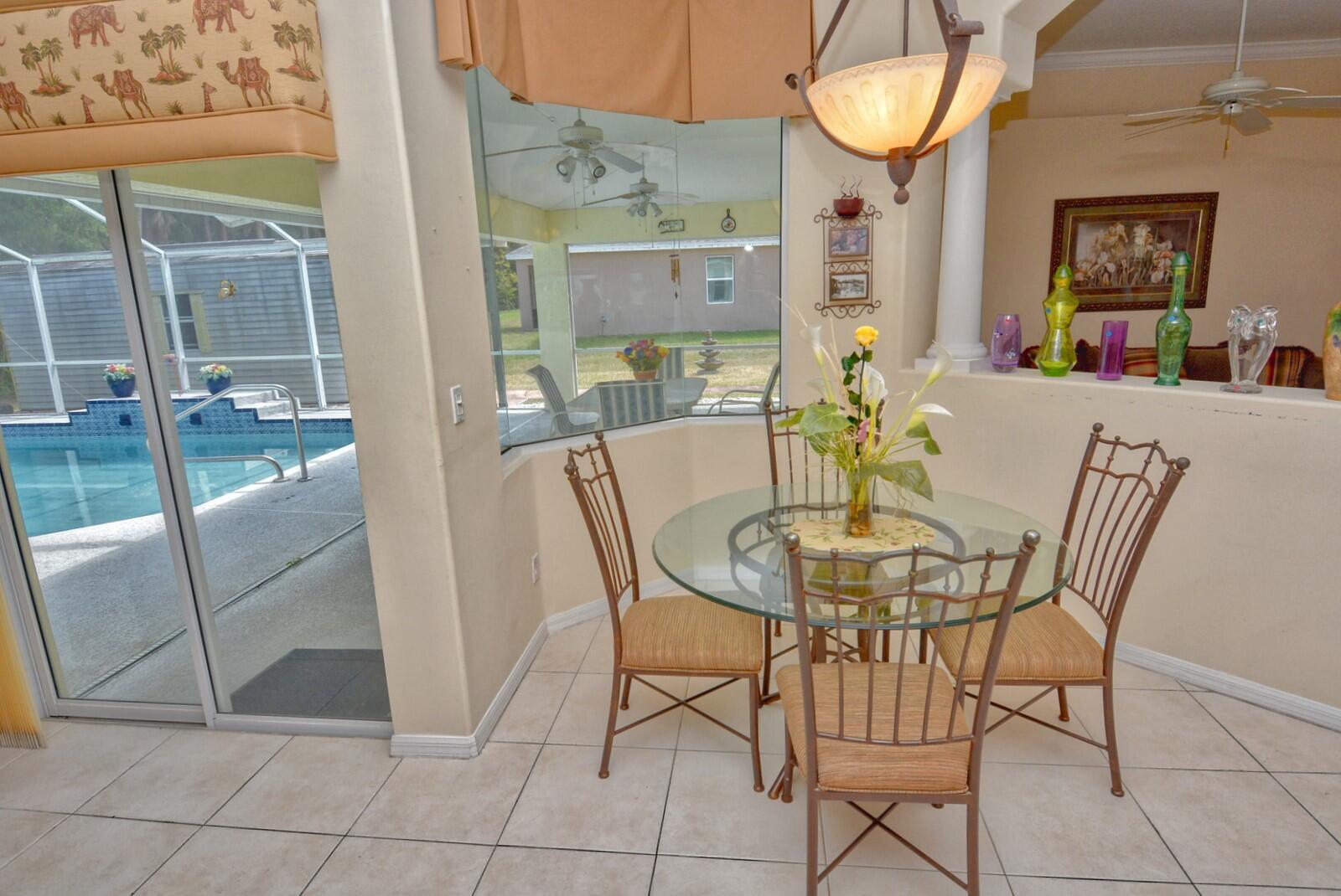2041 Southwest Villanova Road Port St. Lucie, FL 34953 - Photo 11 of 42 a view of a dining room with furniture