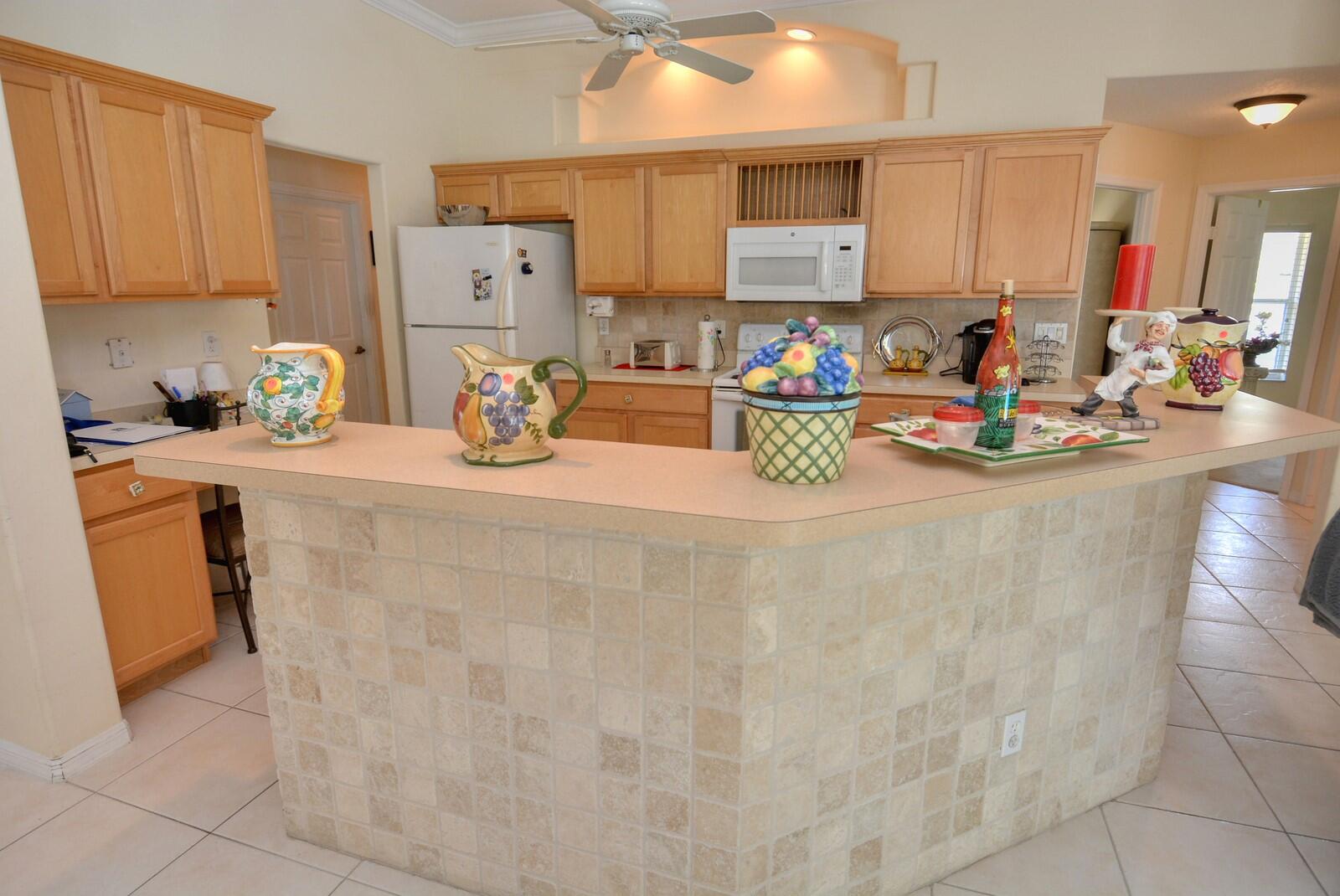 2041 Southwest Villanova Road Port St. Lucie, FL 34953 - Photo 14 of 42 a open kitchen with a sink and cabinets