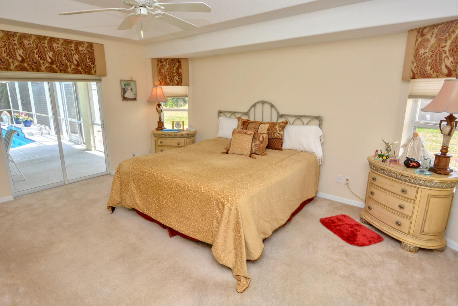 2041 Southwest Villanova Road Port St. Lucie, FL 34953 - Photo 19 of 42 a bedroom with a bed and a dresser