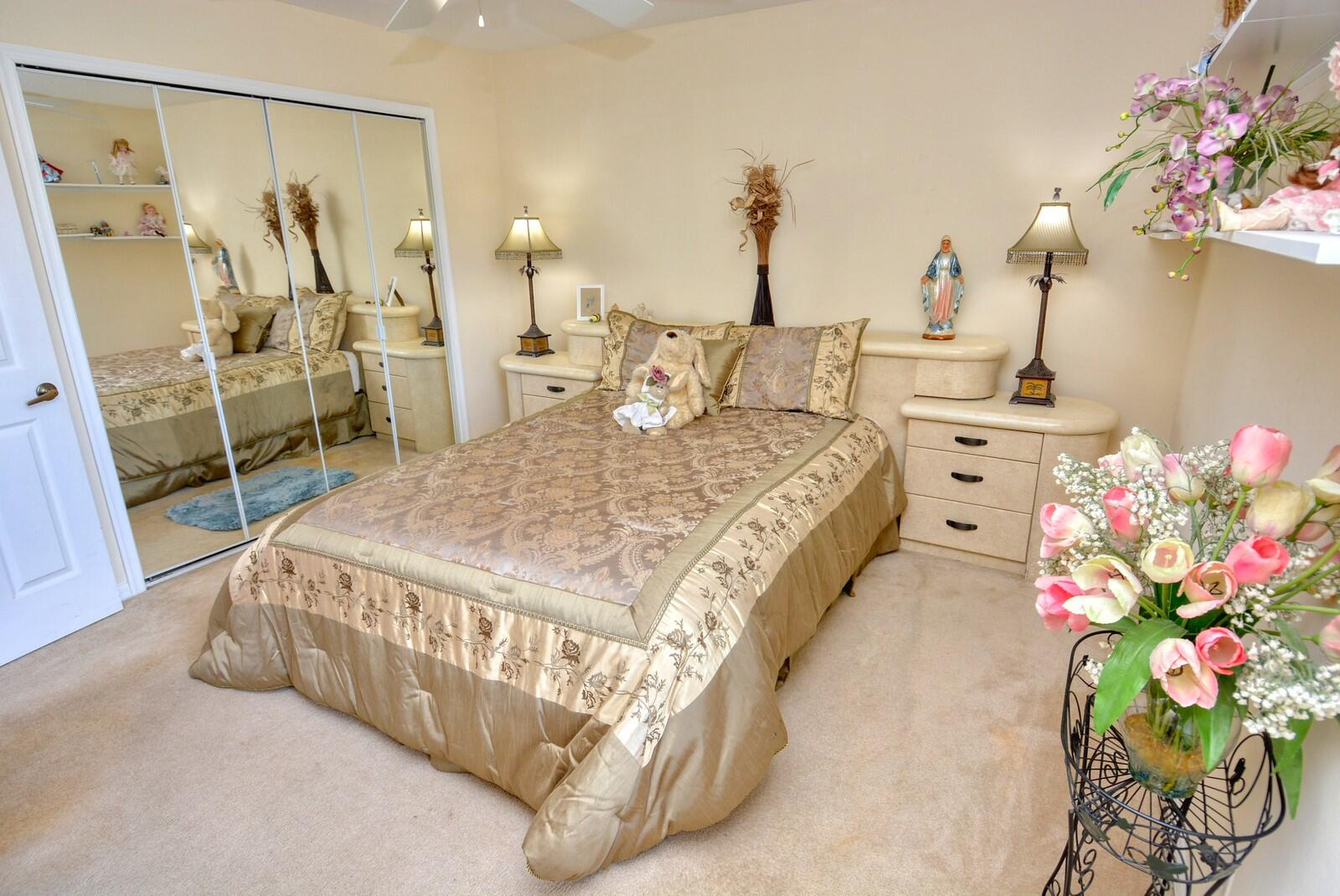 2041 Southwest Villanova Road Port St. Lucie, FL 34953 - Photo 25 of 42 a bed sitting in a bedroom next to a window