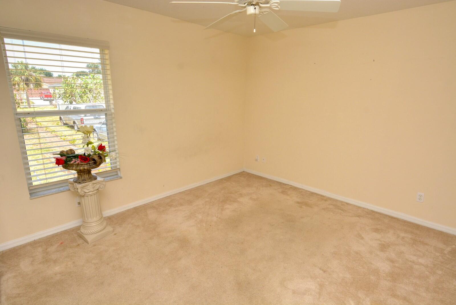 2041 Southwest Villanova Road Port St. Lucie, FL 34953 - Photo 28 of 42 an empty room with a window