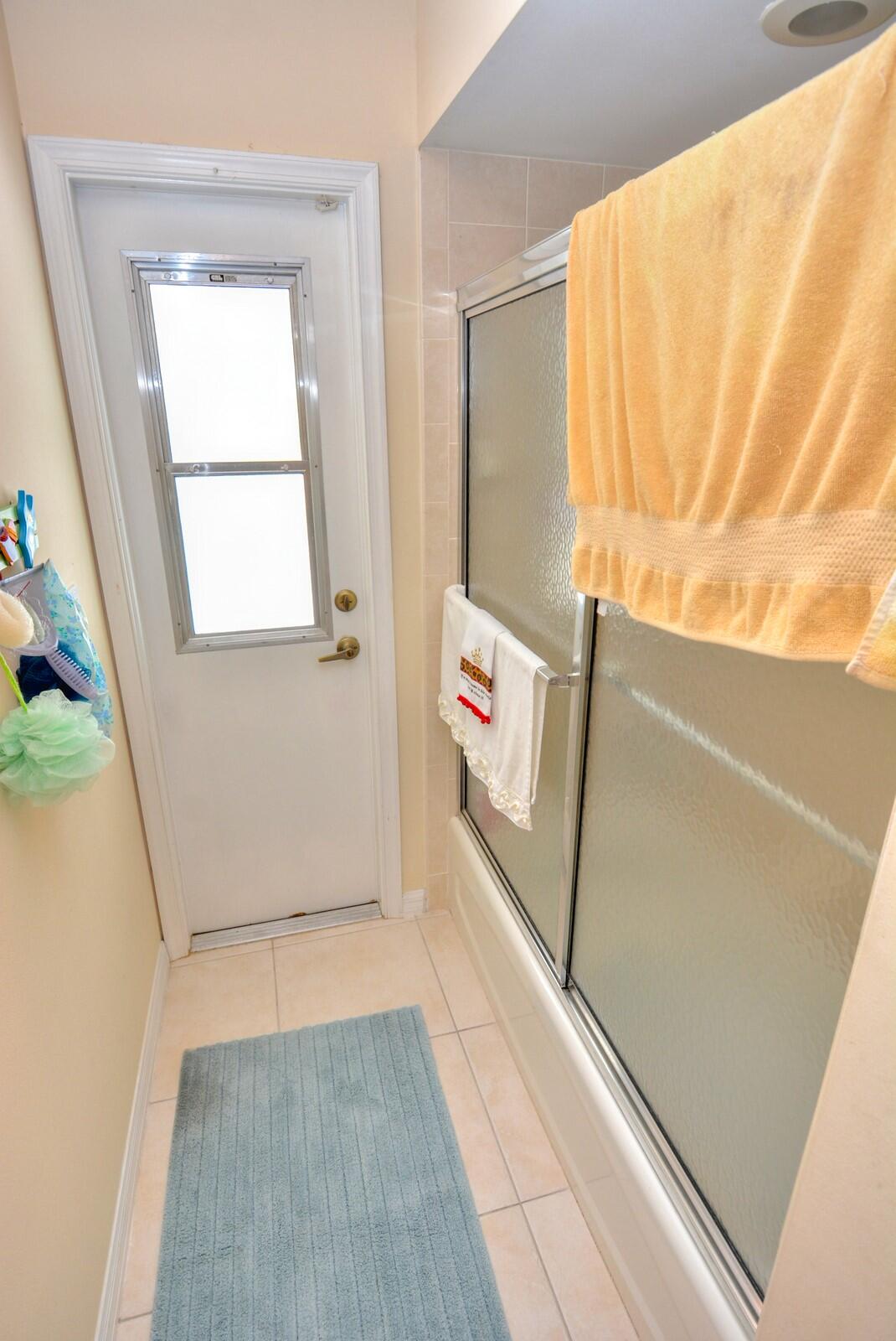 2041 Southwest Villanova Road Port St. Lucie, FL 34953 - Photo 31 of 42 a view of washer and dryer with wooden floor