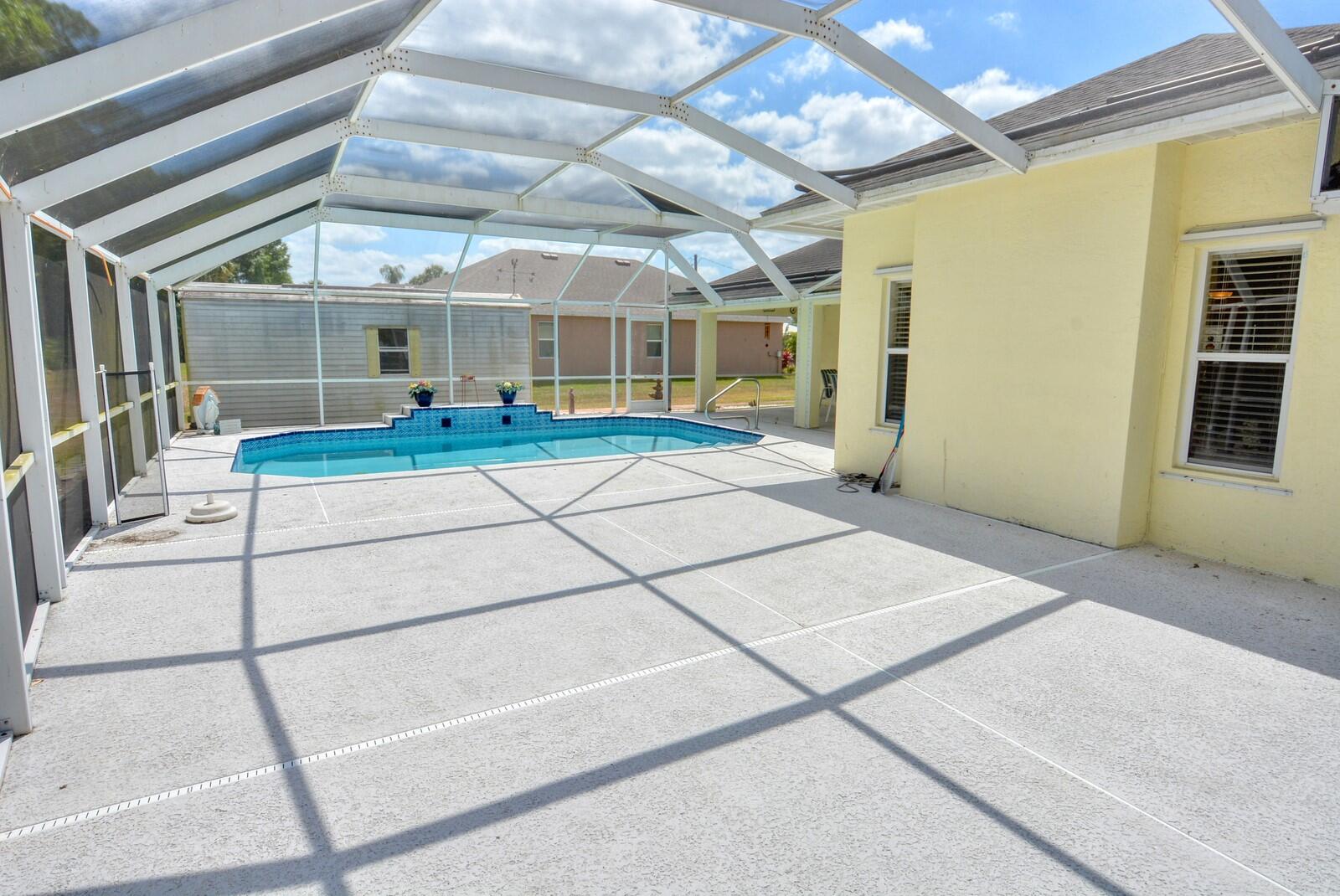 2041 Southwest Villanova Road Port St. Lucie, FL 34953 - Photo 39 of 42 a view of a room with wooden floor and windows