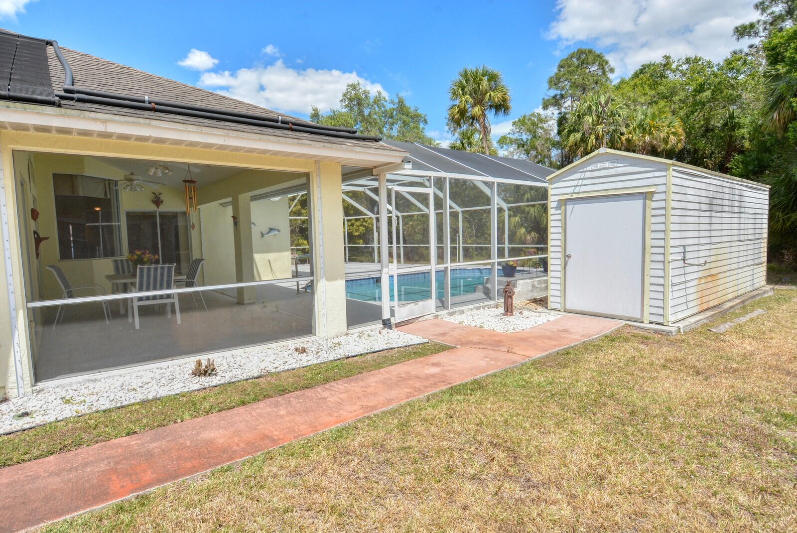 2041 Southwest Villanova Road Port St. Lucie, FL 34953 - Photo 40 of 42 a view of a house with a backyard and balcony