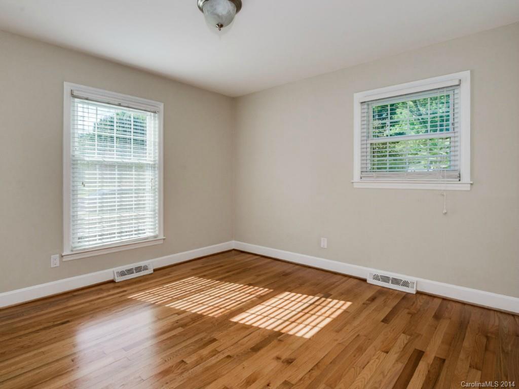 5600 Londonderry Road Charlotte, NC 28210 - Photo 11 of 15 a view of an empty room with wooden floor and a window