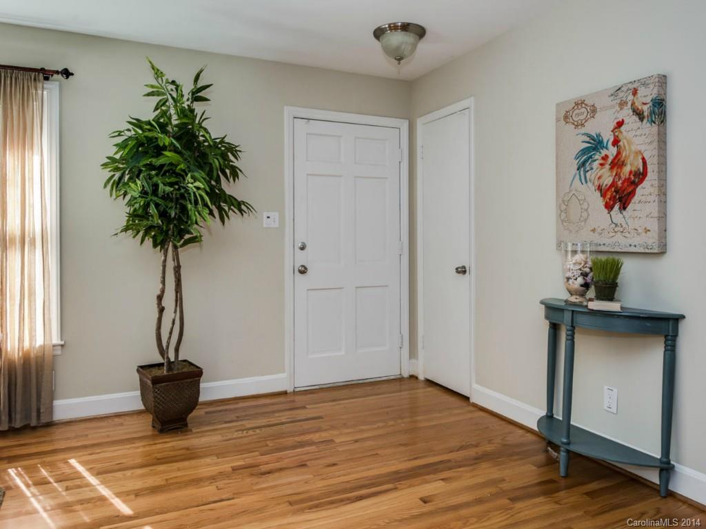 5600 Londonderry Road Charlotte, NC 28210 - Photo 4 of 15 a view of a hallway with wooden floor and a potted plant