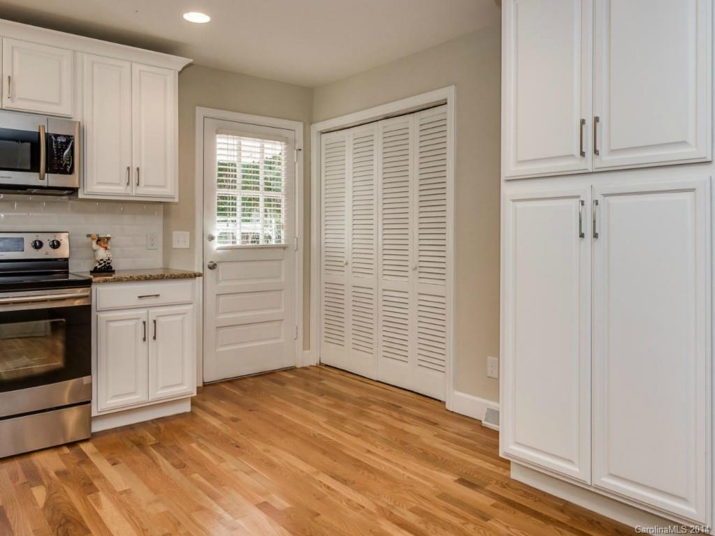 5600 Londonderry Road Charlotte, NC 28210 - Photo 6 of 15 a kitchen with a stove a sink and a microwave