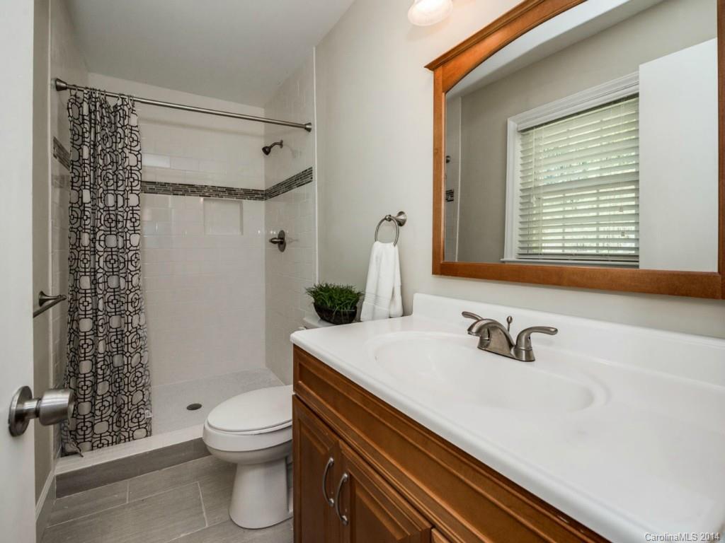 5600 Londonderry Road Charlotte, NC 28210 - Photo 9 of 15 a bathroom with a sink a toilet and shower