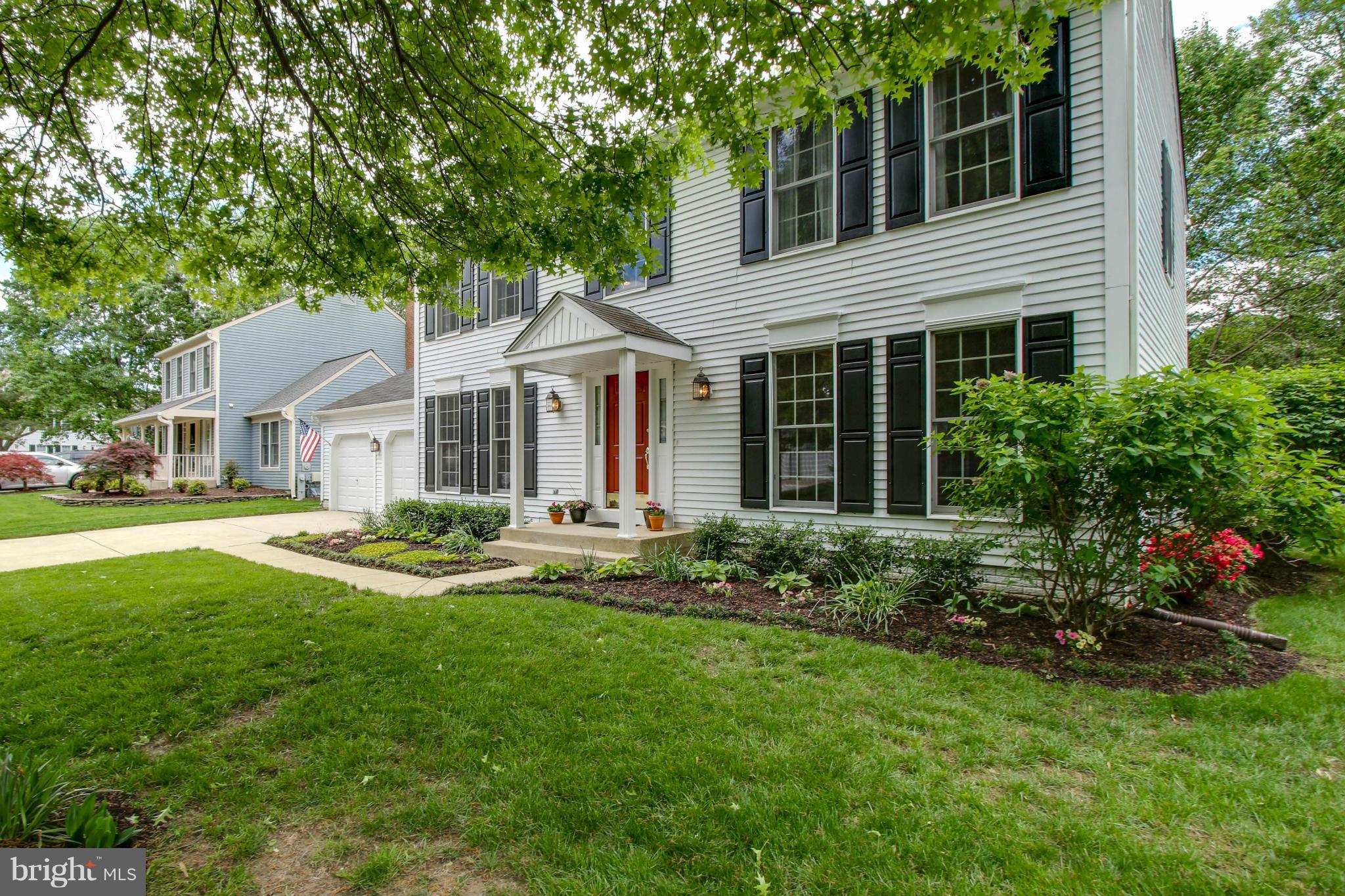 309 Saddle Ridge Road Annapolis, MD 21403 - Photo 1 of 29 a front view of a house with a garden and porch
