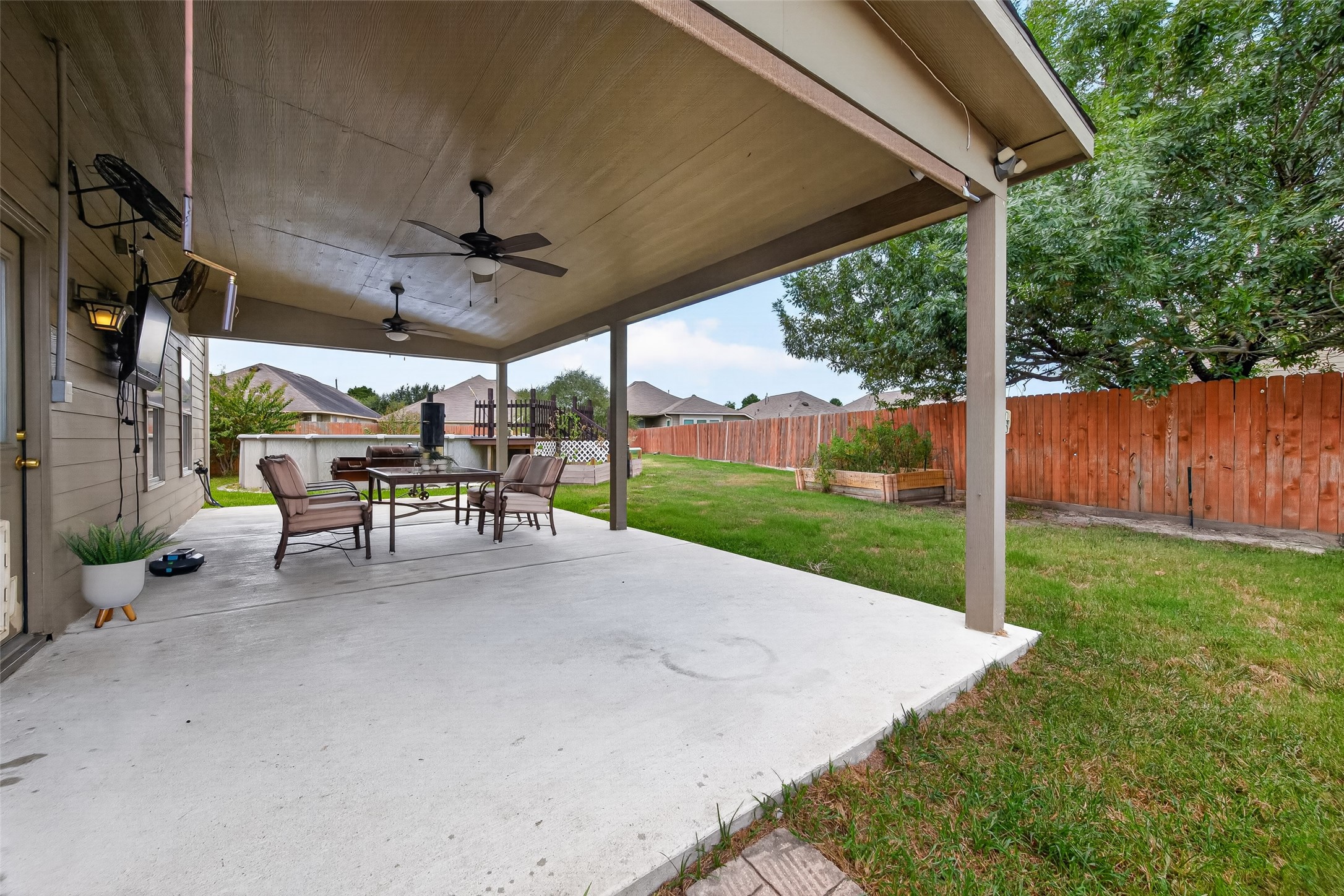 6822 Baron Gate Court Spring, TX 77379 - Photo 43 of 49 Step outside and envision the possibilities in this wonderful backyard space!
