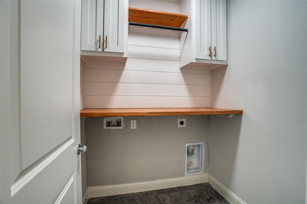 2811 Killdeer Trail Prosper, TX 75078 - Photo 13 of 36 Laundry area with electric dryer hookup, cabinet space, and washer hookup
